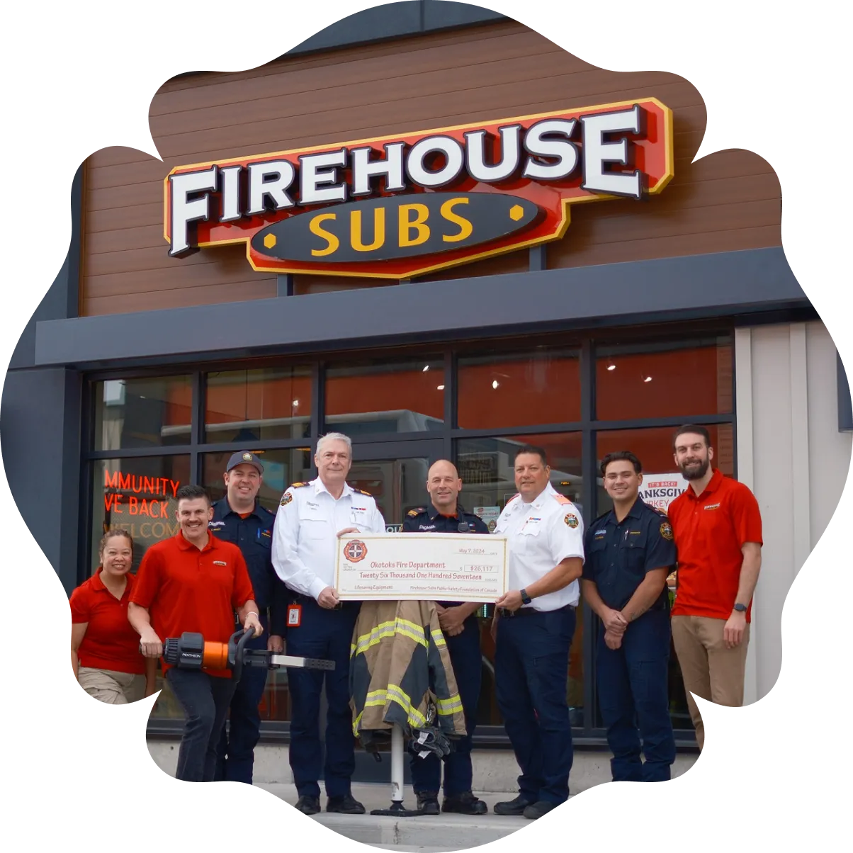 handing giant check to firefighters